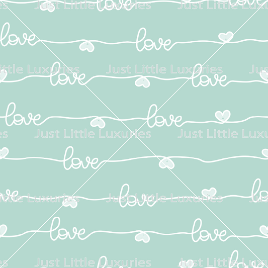 White “love” lettering with hearts on a pastel mint background digital edible image